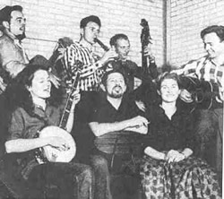 Back Row: Alan Lomax, Bruce Turner, Jim Bray, Brian Daly. Front Row: Peggy Seeger, Ewan MacColl, Shirley Collins.